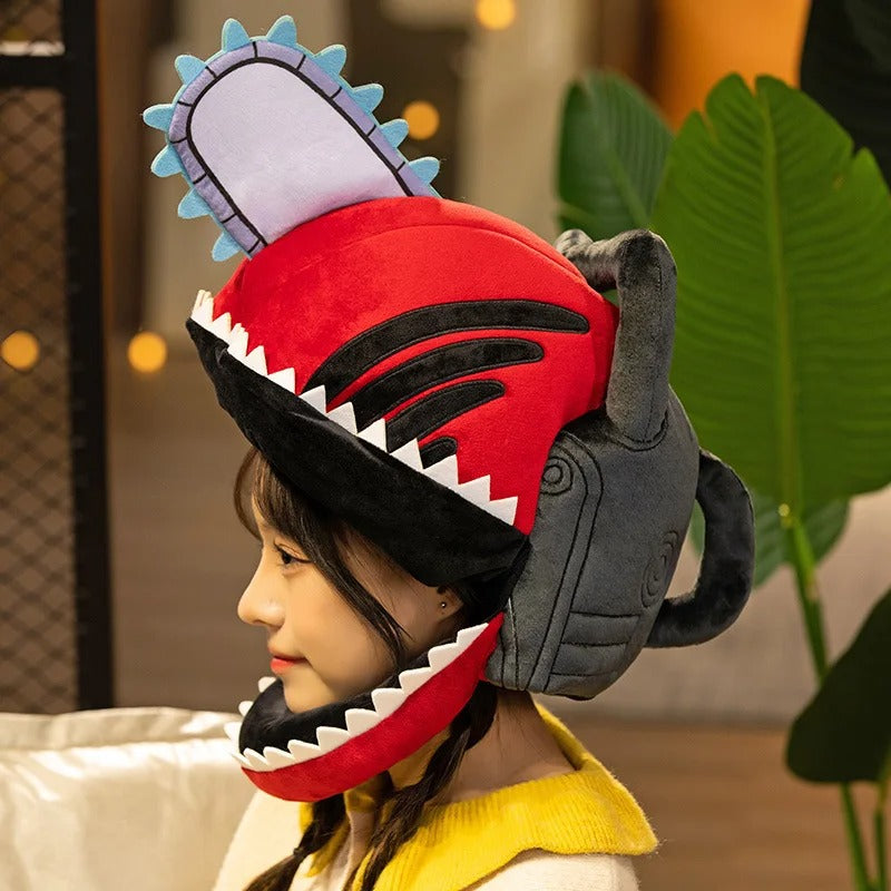 Child wearing a shark-themed helmet with a red mouth and gray body. Chainsaw Man Denji Premium Plush Headgear Cosplay Helmet – 35x25cm Wearable Ultra-Soft Anime Costume Mask
