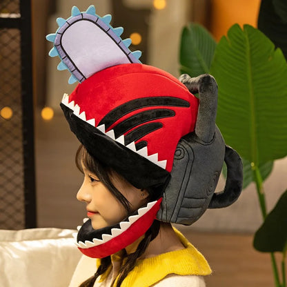 Child wearing a shark-themed helmet with a red mouth and gray body. Chainsaw Man Denji Premium Plush Headgear Cosplay Helmet – 35x25cm Wearable Ultra-Soft Anime Costume Mask