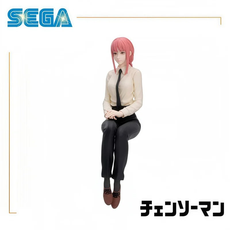 Figure of a character with pink hair and a white shirt sitting on a white background with Sega logo. Chainsaw Man Makima Authentic Chokonose Premium Sitting Figure – Public Safety Sofa Pose Character Statue by SEGA