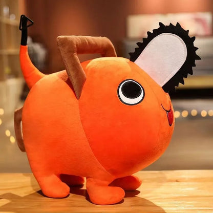 Orange plush toy with a black eye and white blush on a wooden surface. Chainsaw Man Pochita Premium Plush Toy