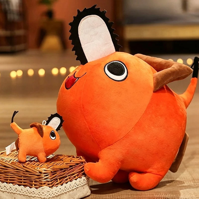 Orange plush toy with a smaller version on a woven basket. Chainsaw Man Pochita Premium Plush Toy small and big