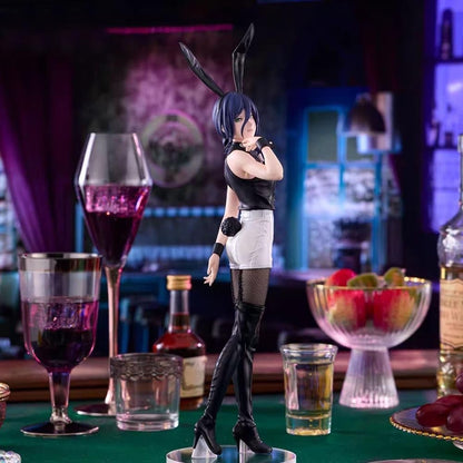Figurine of a character with bunny ears on a table with drinks and fruit. Chainsaw Man Reze Authentic 27cm BiCute Bunnies Figure – Real Fabric Fishnet Tuxedo Costume Movie Statue by FuRyu