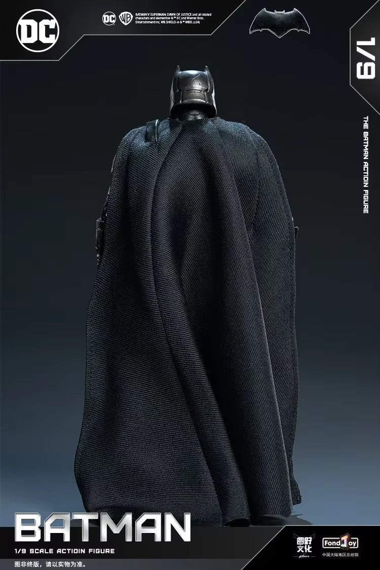 Batman action figure with cape and helmet on a dark background, featuring DC Comics logo. DC Comics Armored Batman (Batman v Superman Edition) 1/9 Scale Premium Action Figure by FondJoy