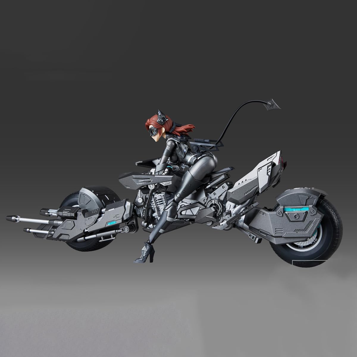 Mechanical motorcycle with a rider on a gray background DC Comics Catwoman & Bat-Pod (DC-02) 1/10 Scale Mecha-Girl Model Kit by MS General
