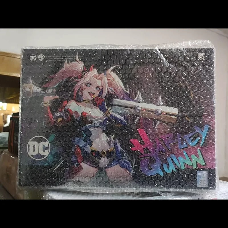 Product packaging featuring a character from DC Comics with colorful text on a clear background. DC Comics Harley Quinn (Dual Body) 1/10 Scale Mecha-Girl Model Kit by MS General