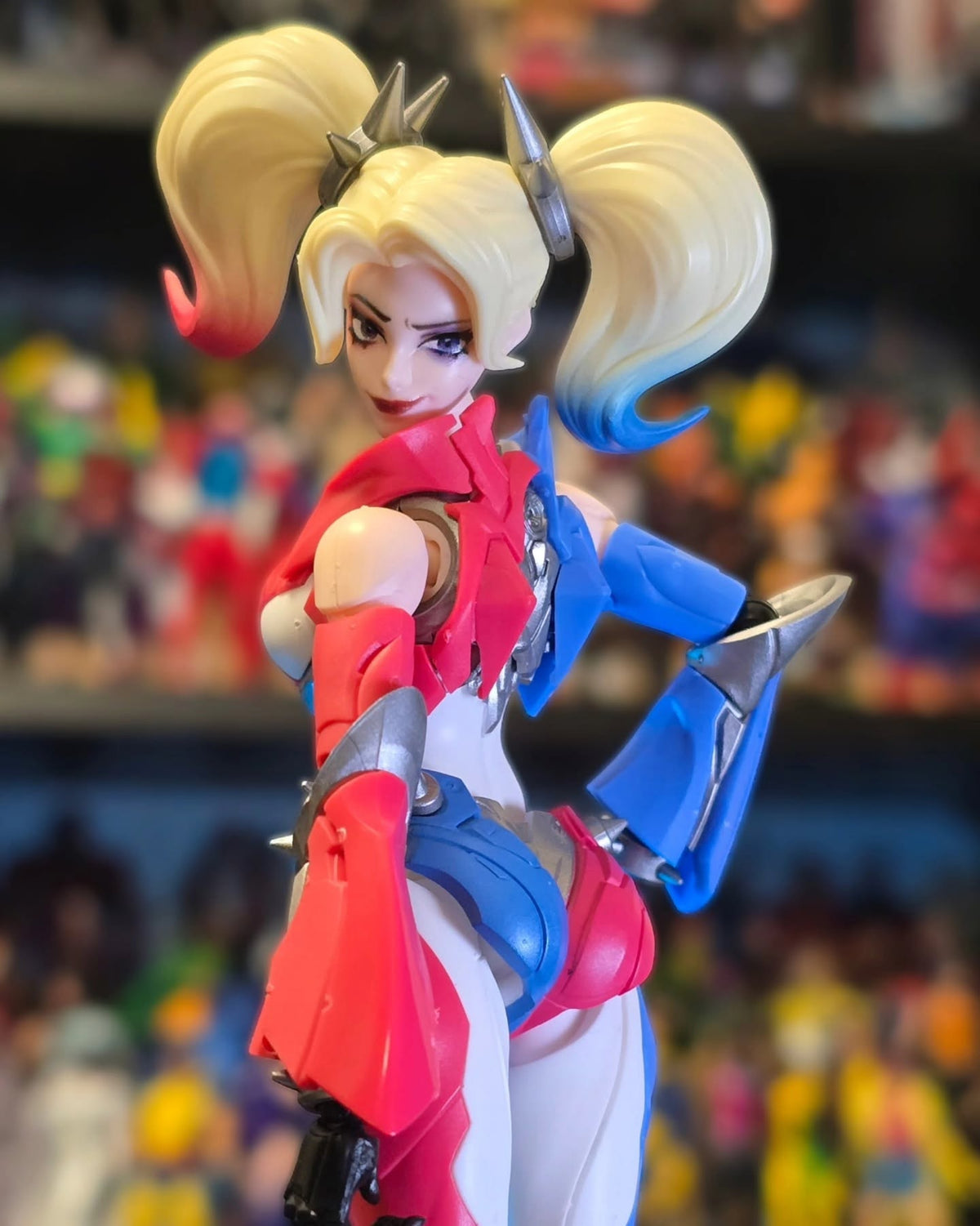 Action figure with colorful outfit and styled hair against a blurred background DC Comics Harley Quinn (Shining Version) 1/12 Scale Precision Assembly Figure by Blokees