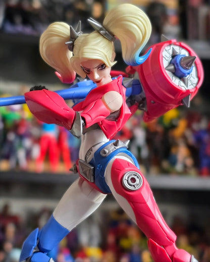 Action figure of a character with blonde hair and red and blue costume in front of a blurred background DC Comics Harley Quinn (Shining Version) 1/12 Scale Precision Assembly Figure by Blokees