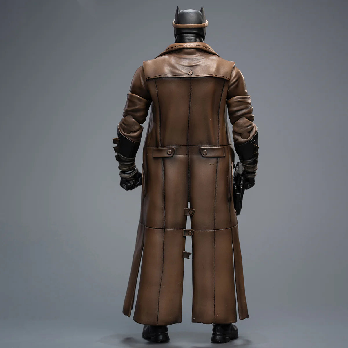 Person wearing a long brown leather coat and helmet on a gray background DC Comics Knightmare Desert Batman (Batman v Superman Edition) 1/9 Scale Premium Action Figure by FondJoy