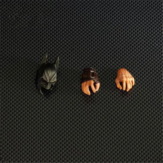 Three small figurines on a textured black surface DC Comics The Dark Knight Rises: Bane Play Arts Kai 26cm Premium Action Figure by Square Enix