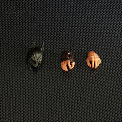 Three small figurines on a textured black surface DC Comics The Dark Knight Rises: Bane Play Arts Kai 26cm Premium Action Figure by Square Enix