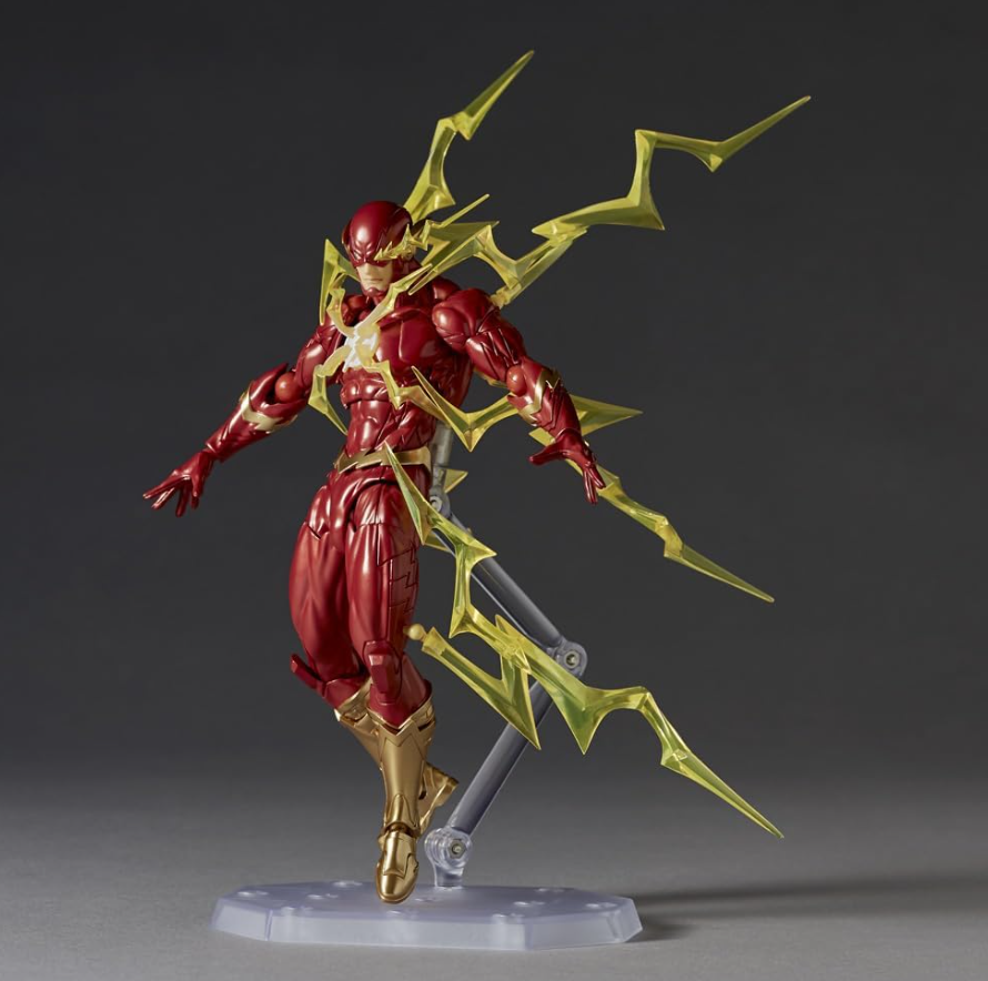 Superhero action figure with red and gold costume and yellow weapon on a dark background DC Heroes The Flash (Amazing Yamaguchi No.042) Revoltech Action Figure by Kaiyodo