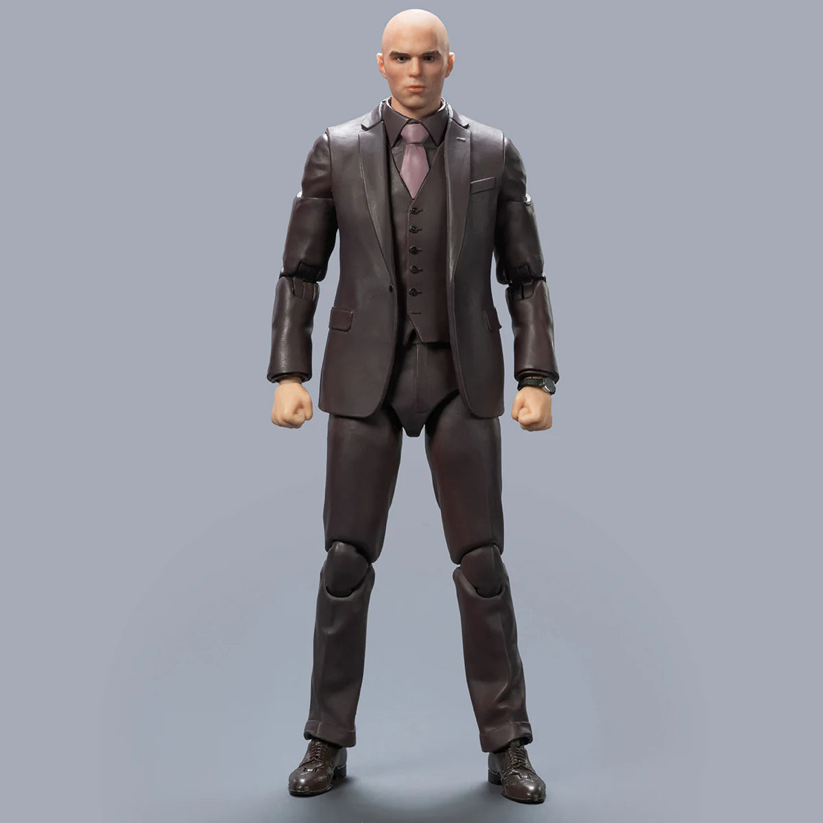 Action figure in a brown suit on a gray background DC Studios Lex Luthor (The Mastermind Edition) 1/9 Scale Premium Action Figure by FondJoy