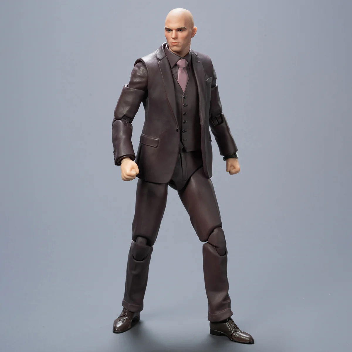 Action figure in a brown suit on a gray background DC Studios Lex Luthor (The Mastermind Edition) 1/9 Scale Premium Action Figure by FondJoy