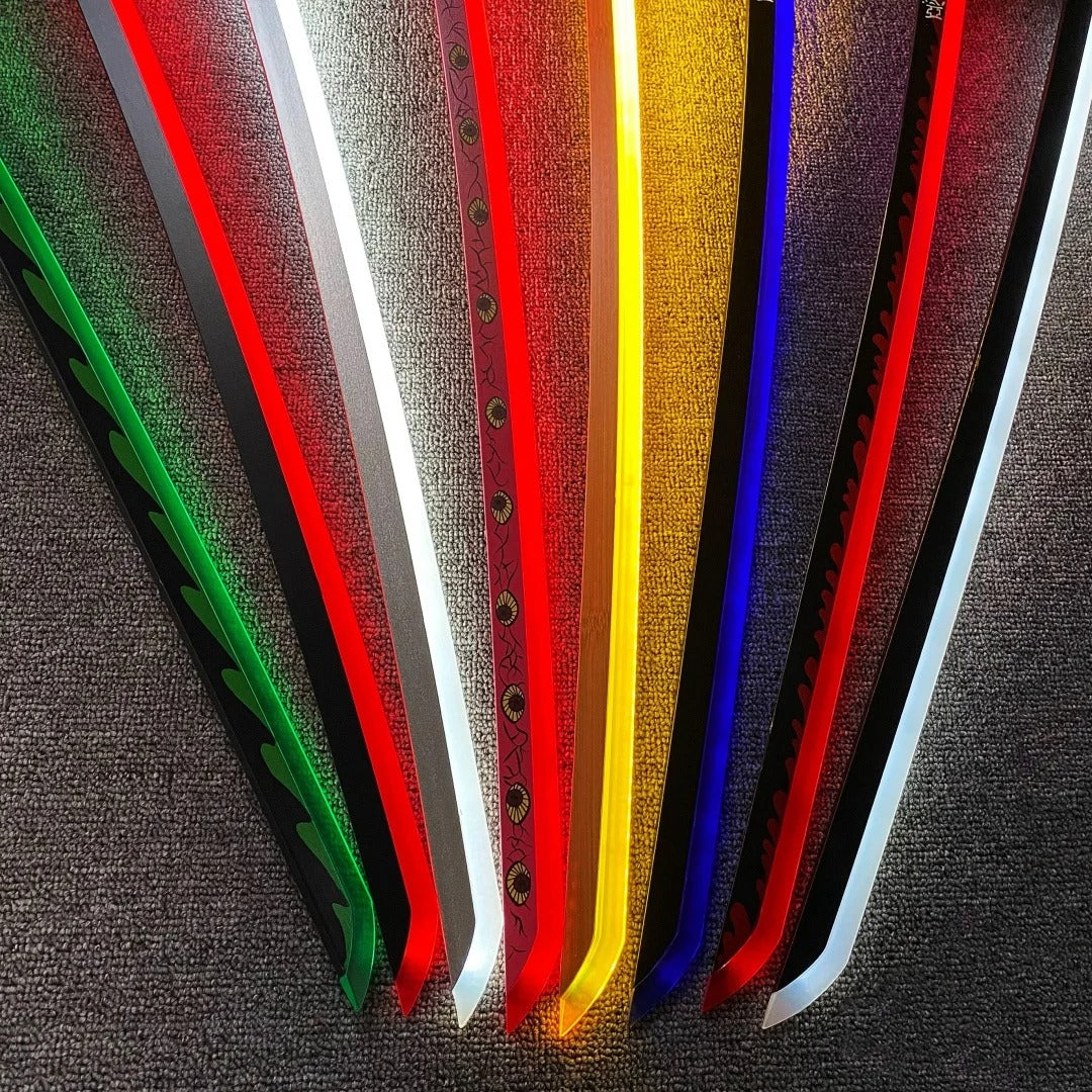 Set of colorful blades on a textured surface Demon Slayer 40-Inch Illuminated LED Bamboo Nichirin Katana Prop Replicas – Next-Gen USB-C Rechargeable Touch-Activated Cosplay & Display Series