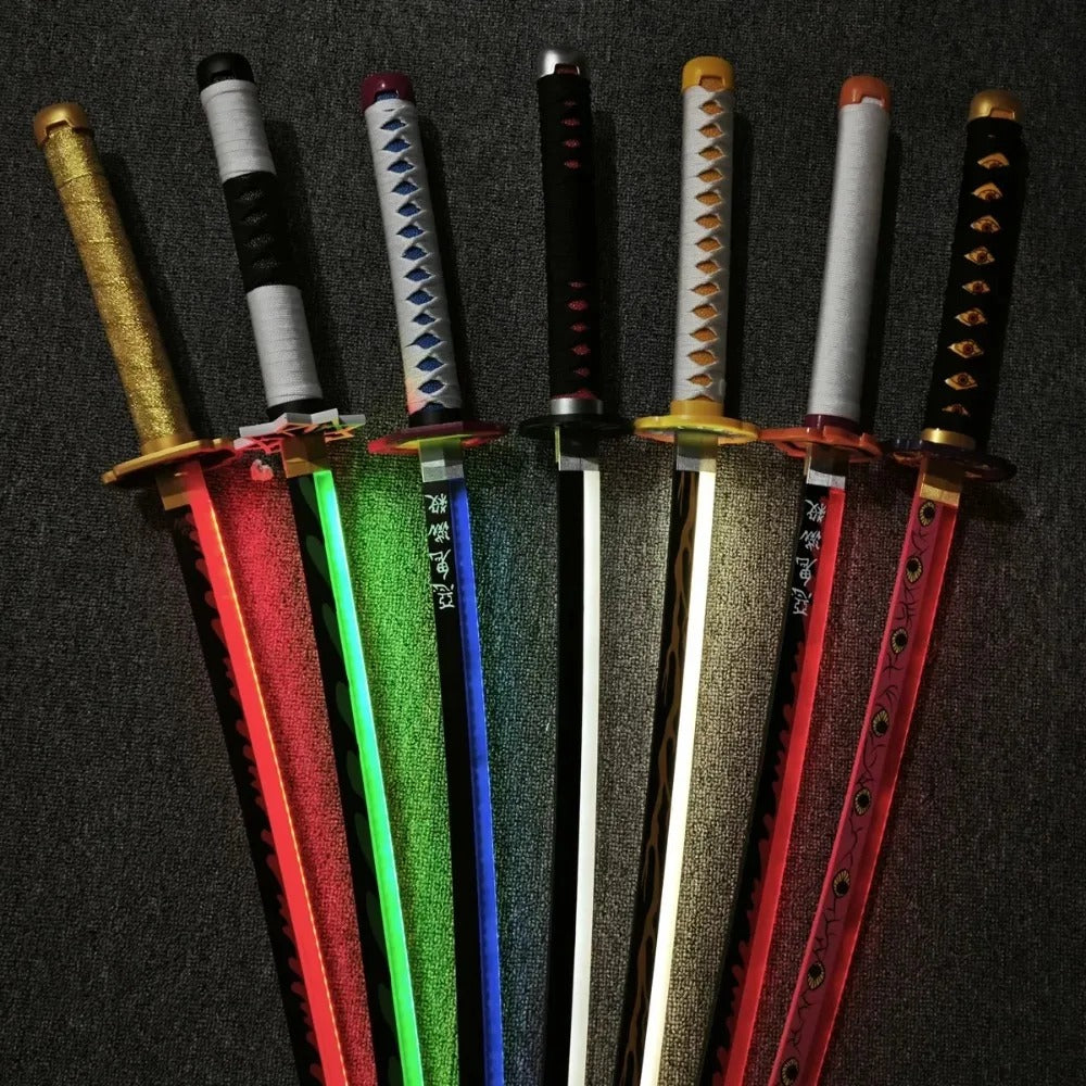 Set of colorful toy swords with various designs on a dark background Demon Slayer 40-Inch Illuminated LED Bamboo Nichirin Katana Prop Replicas – Next-Gen USB-C Rechargeable Touch-Activated Cosplay & Display Series