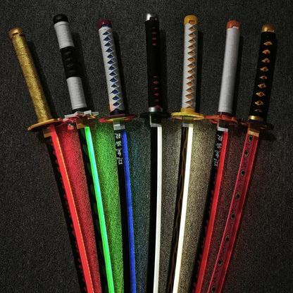 Set of colorful toy swords with various designs on a dark background Demon Slayer 40-Inch Illuminated LED Bamboo Nichirin Katana Prop Replicas – Next-Gen USB-C Rechargeable Touch-Activated Cosplay & Display Series
