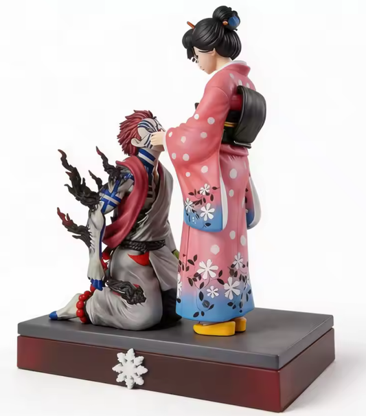 Two figurines, one in traditional attire and the other in a more modern outfit, on a white background. Demon Slayer: Kimetsu no Yaiba Akaza (Hakuji) & Koyuki Authentic 10.43-Inch PVC Diorama Statue Figure – The Past Memories Edition