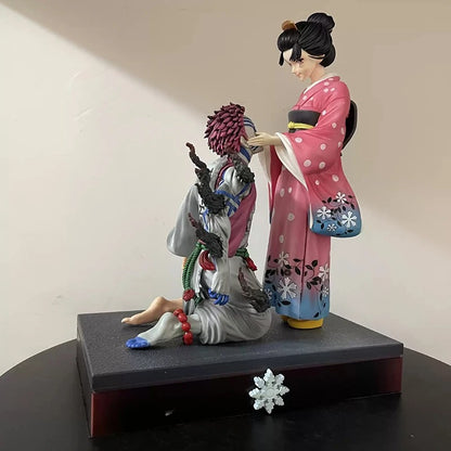 Two figurines in traditional attire on a black base with a plain background Demon Slayer: Kimetsu no Yaiba Akaza (Hakuji) & Koyuki Authentic 10.43-Inch PVC Diorama Statue Figure – The Past Memories Edition