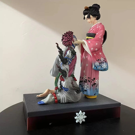 Two figurines in traditional attire on a black base with a plain background Demon Slayer: Kimetsu no Yaiba Akaza (Hakuji) & Koyuki Authentic 10.43-Inch PVC Diorama Statue Figure – The Past Memories Edition