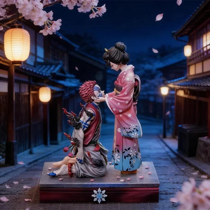 Statue of two people in traditional Japanese attire with cherry blossoms and lanterns in the background. Demon Slayer: Kimetsu no Yaiba Akaza (Hakuji) & Koyuki Authentic 10.43-Inch PVC Diorama Statue Figure – The Past Memories Edition