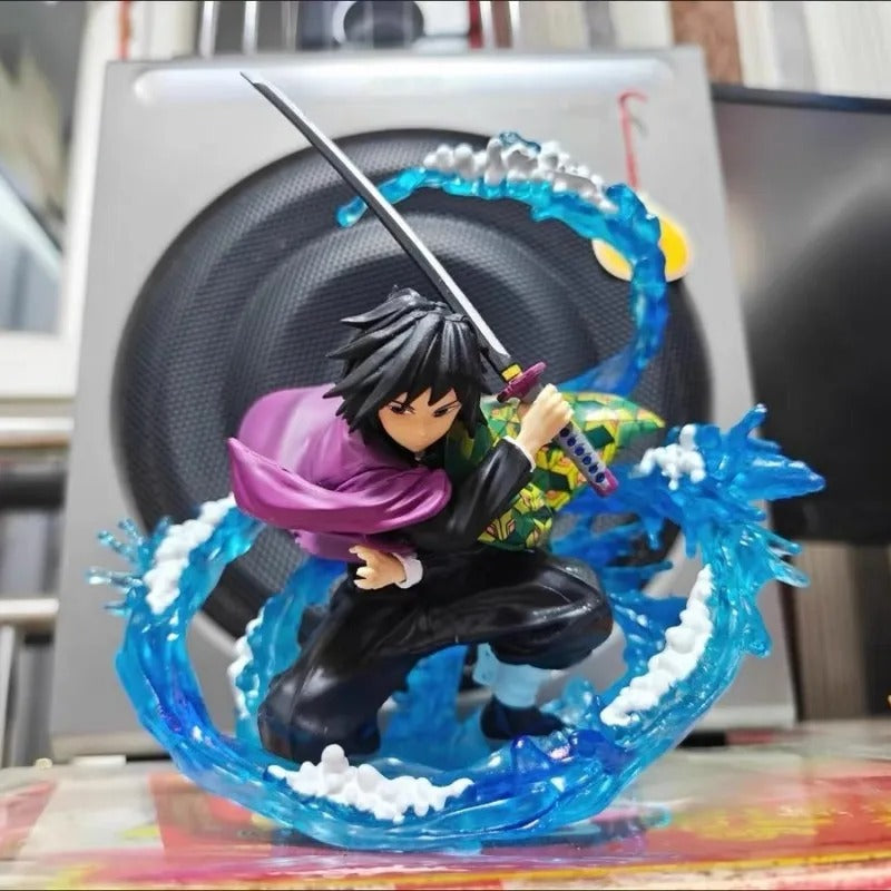 Action figure with a dynamic pose in front of a speaker Demon Slayer: Kimetsu no Yaiba Giyu Tomioka Authentic 17cm PVC Figure – Water Breathing Eleventh Form Dead Calm Special Edition