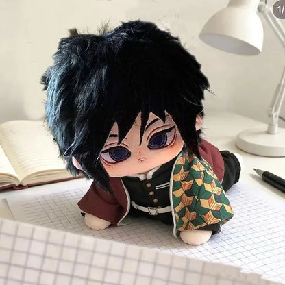 Plush toy of an anime character on a desk with a lamp and notebook in the background Demon Slayer: Kimetsu no Yaiba Giyu Tomioka Premium 20cm Super Soft Plushie Doll – Embroidered Cat Paw Edition