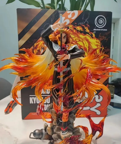 Detailed figurine with fiery effects in front of a branded box Demon Slayer: Kimetsu no Yaiba Kyojuro Rengoku Authentic 30cm GK Style Premium Statue Figurine – Flame Hashira Blazing Inferno Edition box