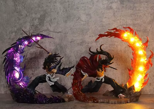 Two animated character figurines with LED lights, one purple and one red, on a textured surface. Demon Slayer: Kimetsu no Yaiba Legendary Twin Bloodlines Premium PVC Combat Statue – Yoriichi Tsugikuni / Kokushibo Upper Moon One