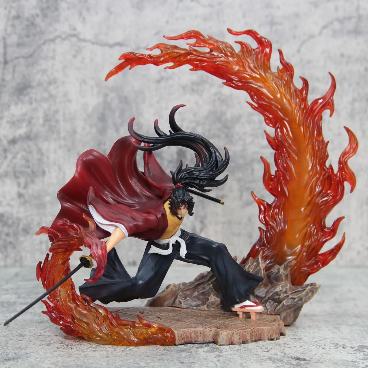 Action figure with red hair and black outfit surrounded by flames on a gray background Demon Slayer: Kimetsu no Yaiba Legendary Twin Bloodlines Premium PVC Combat Statue – Yoriichi Tsugikuni / Kokushibo Upper Moon One
