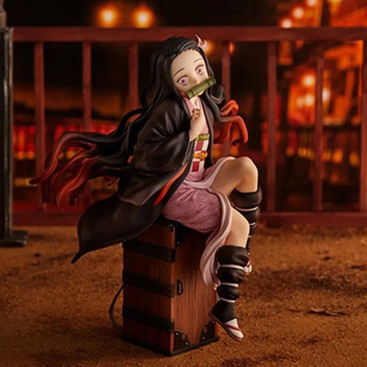 Anime character figurine sitting on a barrel with a dark background Demon Slayer: Kimetsu no Yaiba Nezuko Kamado Authentic 15cm Sitting PVC Figure – Box Perch Display Edition