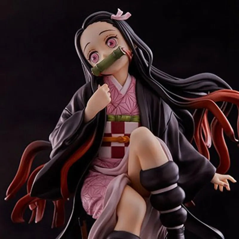 Anime character figurine with long black hair and a pink outfit on a dark background Demon Slayer: Kimetsu no Yaiba Nezuko Kamado Authentic 15cm Sitting PVC Figure – Box Perch Display Edition 