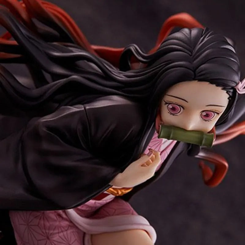 Anime character figurine with long black hair and red hairband on a dark background Demon Slayer: Kimetsu no Yaiba Nezuko Kamado Authentic 15cm Sitting PVC Figure – Box Perch Display Edition