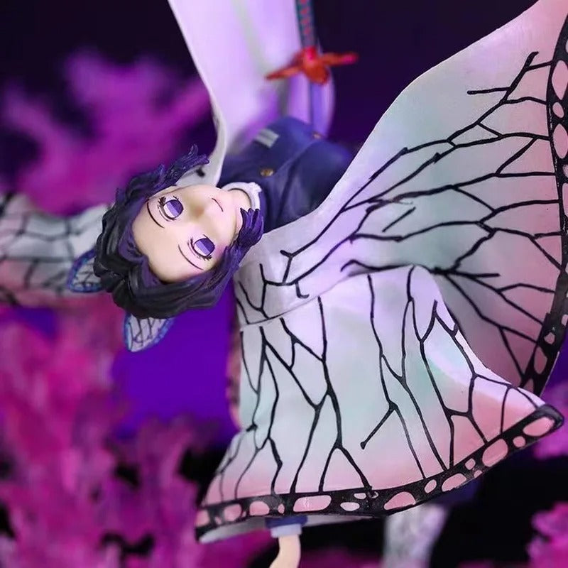 Animated character with butterfly wings against a purple background Demon Slayer: Kimetsu no Yaiba Shinobu Kocho Authentic GK Style Premium PVC Figure – Insect Breathing Butterfly Dance Edition