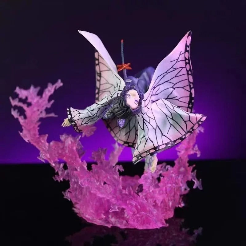 Butterfly-like creature with pink and purple accents on a black background Demon Slayer: Kimetsu no Yaiba Shinobu Kocho Authentic GK Style Premium PVC Figure – Insect Breathing Butterfly Dance Edition