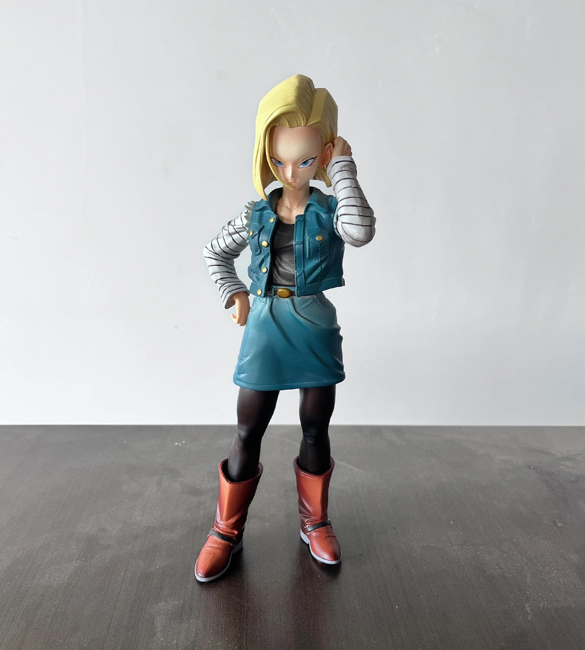 Action figure of a character in a blue outfit with a white background Dragon Ball Z: Android 18 (Lazuli) Premium 11-Inch Statue Figure – Android Saga Classic Denim Outfit Edition