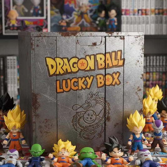 Dragon Ball Lucky Box set with a large metallic gray wooden box featuring 'DRAGON BALL LUCKY BOX' in orange lettering and a dragon design. Small Dragon Ball figure collectibles are arranged around the box in a collector's display.