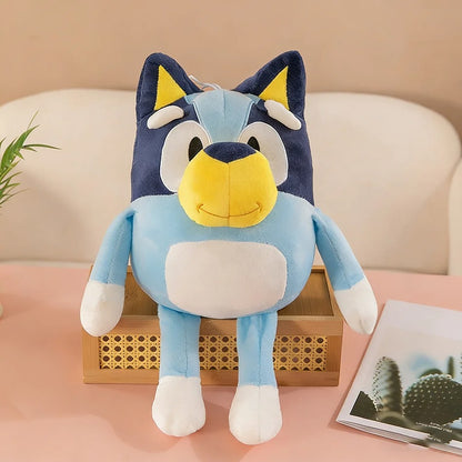 Blue and yellow plush toy sitting on a wooden box with a beige background Huggable Bluey Adventure Companion – 14-Inch Premium Cotton Plush by Titantoons