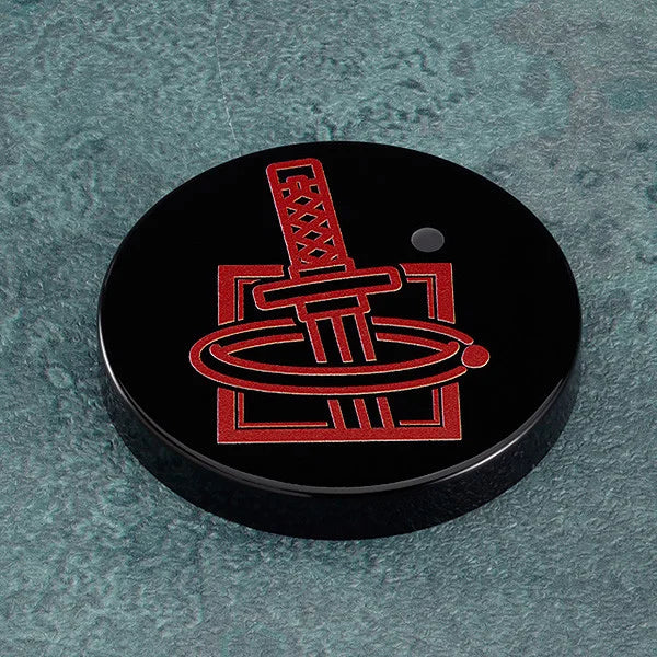 Black puck with red logo on a textured green surface Jujutsu Kaisen 0 Nendoroid No. 1766 Yuta Okkotsu Authentic 10cm Chibi Action Figure – Special Grade Prequel Protagonist Edition base