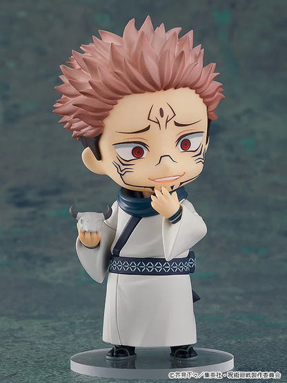 Action figure of a character with spiky pink hair and white outfit on a dark background Jujutsu Kaisen 0 Nendoroid No. 1834 Satoru Gojo Authentic 10cm Chibi Action Figure – Movie Prequel White Bandage Edition cute