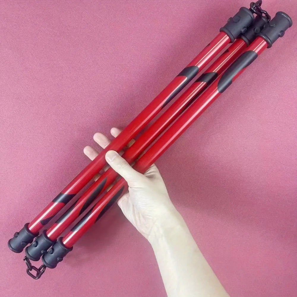 Red tripod with black joints held by a hand against a pink background Jujutsu Kaisen Maki Zenin Authentic 19.7-Inch Sansetsukon Three-Section Staff Cosplay Prop – Special Grade Cursed Tool Playful Cloud Edition
