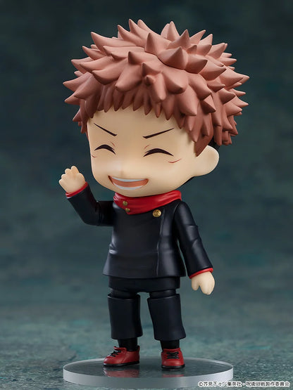 Animated character figurine with spiky hair and a black outfit on a dark background wave