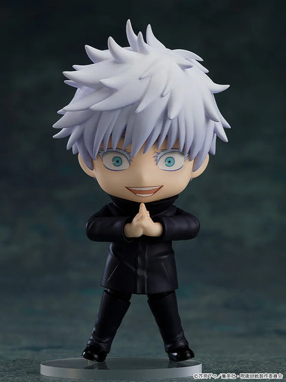Figurine of a character with spiky white hair and blue eyes, wearing a black outfit on a dark background. Jujutsu Kaisen Nendoroid No. 1528 Satoru Gojo Authentic 10cm Chibi Action Figure – Modern World's Strongest Sorcerer Edition pose
