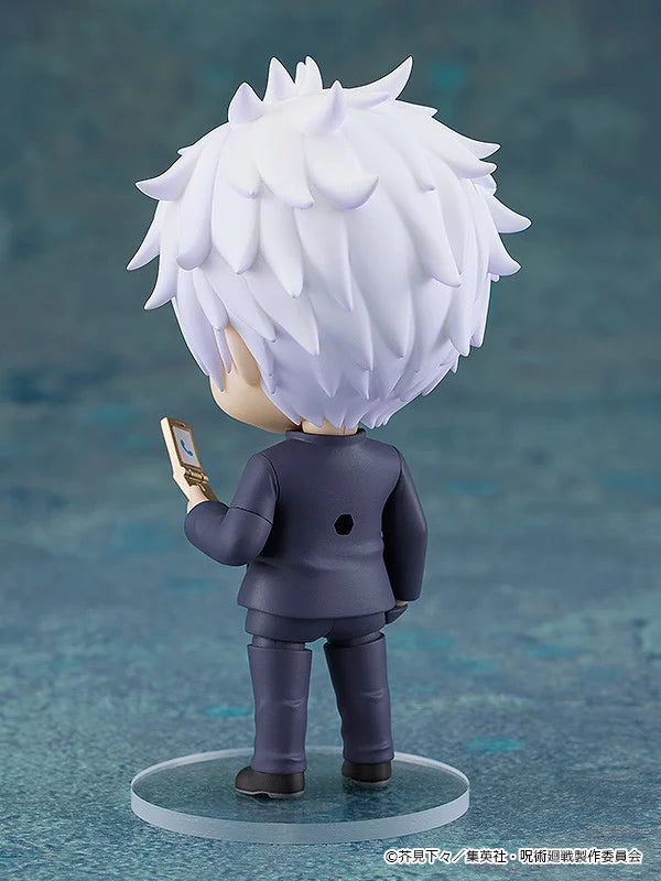 Figurine with white hair and a dark outfit on a blue textured background Jujutsu Kaisen Nendoroid No. 2205 Satoru Gojo Authentic 10cm Chibi Action Figure back
