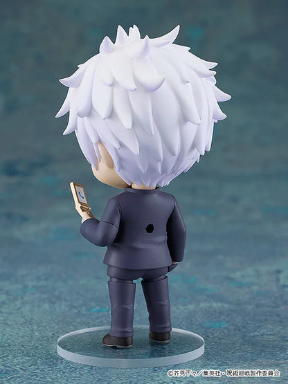 Figurine with white hair and a dark outfit on a blue textured background Jujutsu Kaisen Nendoroid No. 2205 Satoru Gojo Authentic 10cm Chibi Action Figure back
