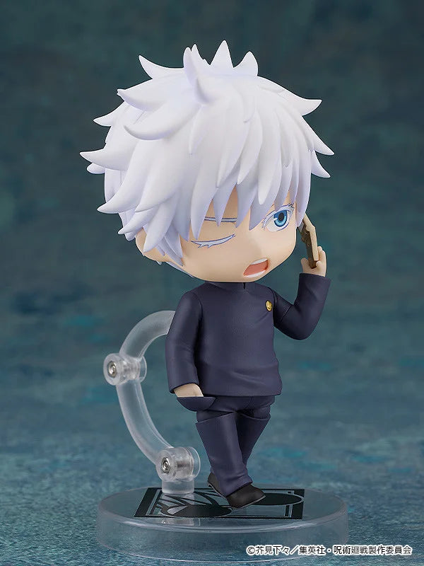 Figurine of a character with white hair and blue eyes, wearing a dark outfit on a blue background. Jujutsu Kaisen Nendoroid No. 2205 Satoru Gojo Authentic 10cm Chibi Action Figure phone