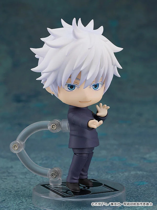 Figurine of a character with white hair and blue eyes on a clear stand against a dark background Jujutsu Kaisen Nendoroid No. 2205 Satoru Gojo Authentic 10cm Chibi Action Figure side