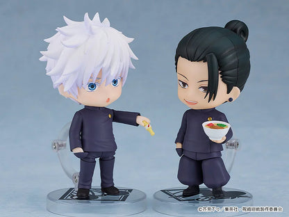 Two figurines in dark uniforms, one with white spiky hair and the other with black hair, on a gray background. Jujutsu Kaisen Nendoroid No. 2206 Suguru Geto Authentic 10cm Chibi Action Figure scene