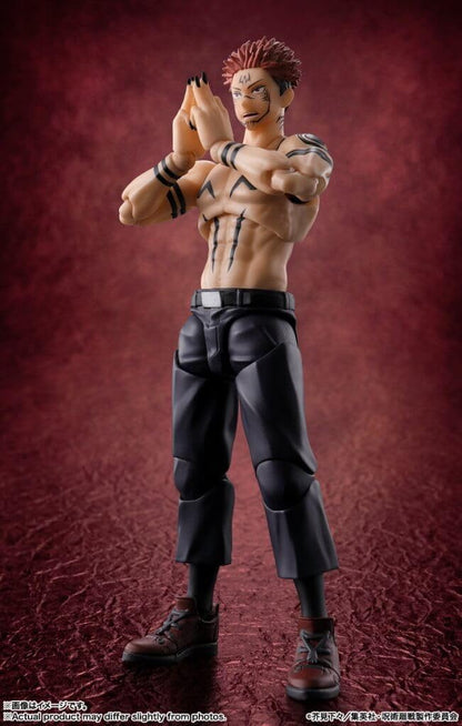 Action figure of a muscular character with tribal tattoos on a red background Jujutsu Kaisen S.H.Figuarts Ryomen Sukuna Authentic 15cm Articulated Action Figure – King of Curses Edition