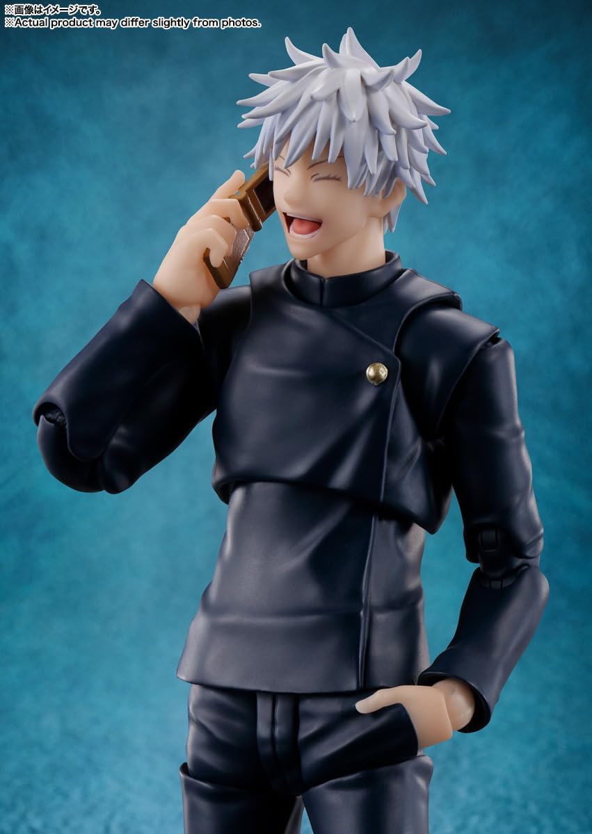 Action figure of a character with spiky white hair and black outfit against a blue background Jujutsu Kaisen S.H.Figuarts Satoru Gojo Authentic 16cm Articulated Action Figure – Tokyo Jujutsu High School Edition phone