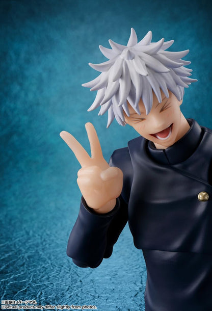 Anime character figurine with spiky hair and a peace sign gesture against a blue background Jujutsu Kaisen S.H.Figuarts Satoru Gojo Authentic 16cm Articulated Action Figure – Tokyo Jujutsu High School Edition pose